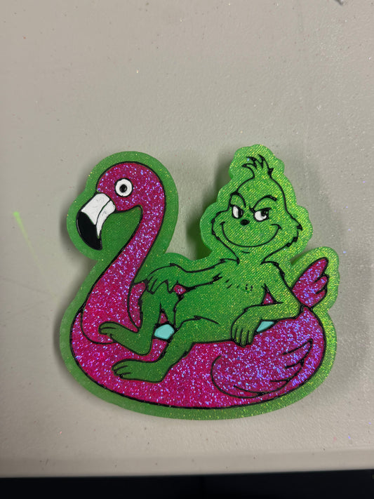 Grinch on flamingo float